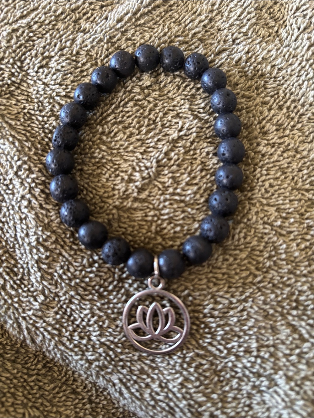 Black Lava Bead Bracelet with Lotus Charm